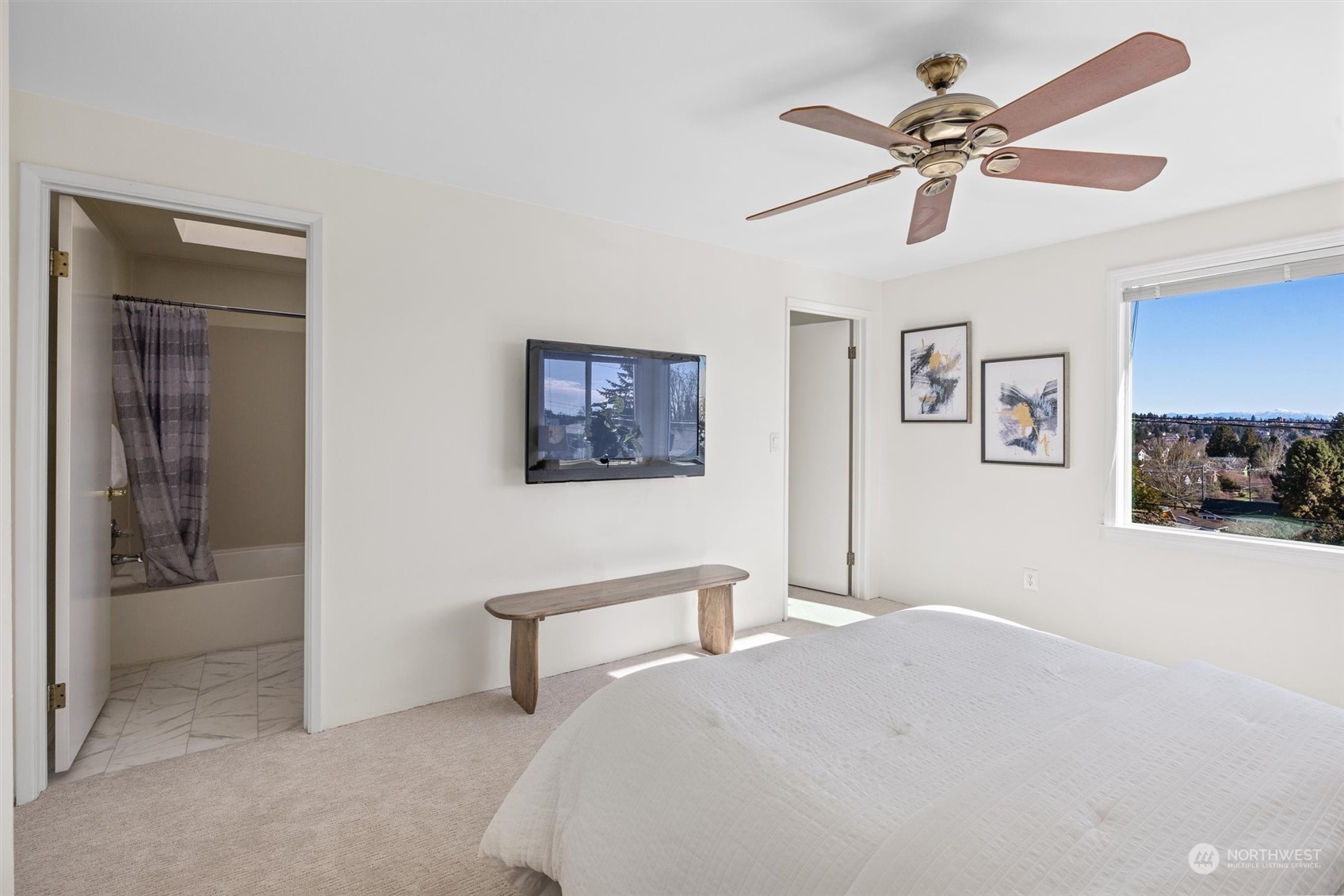7209 Dayton Avenue North Seattle, WA 98103 - Photo 16 of 33 a bedroom with a bed and a view of bathroom