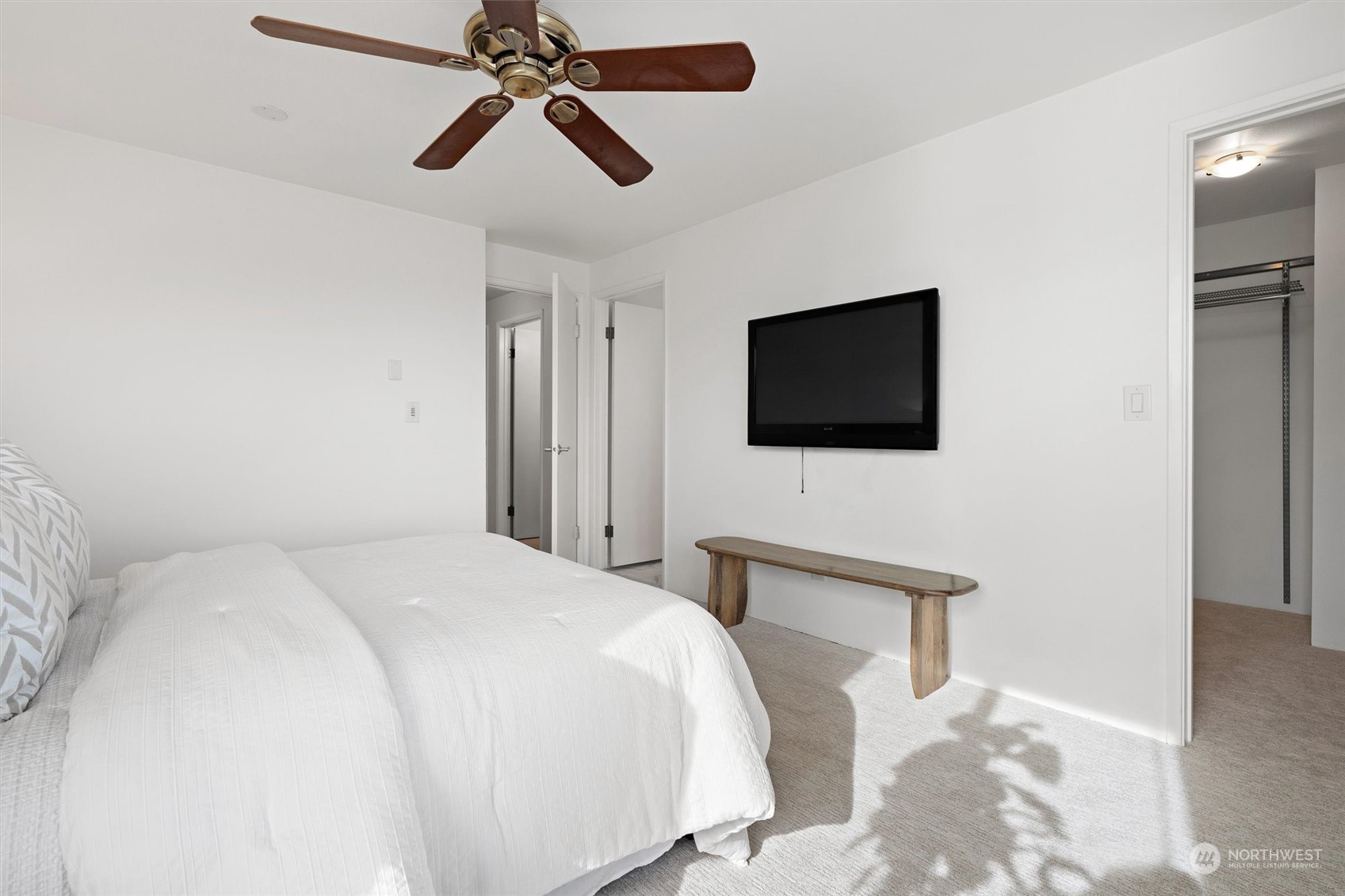 7209 Dayton Avenue North Seattle, WA 98103 - Photo 18 of 33 a bedroom with a bed and a flat screen tv