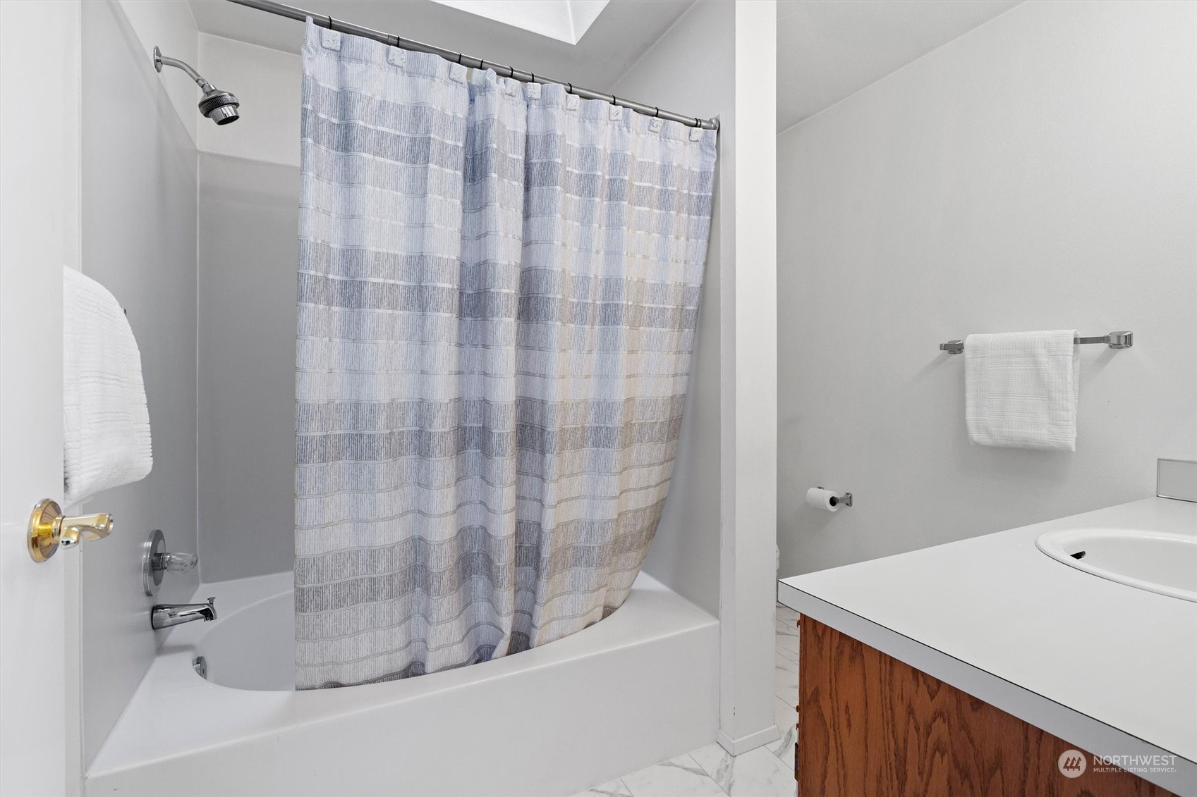 7209 Dayton Avenue North Seattle, WA 98103 - Photo 21 of 33 a bathroom with a bathtub and shower