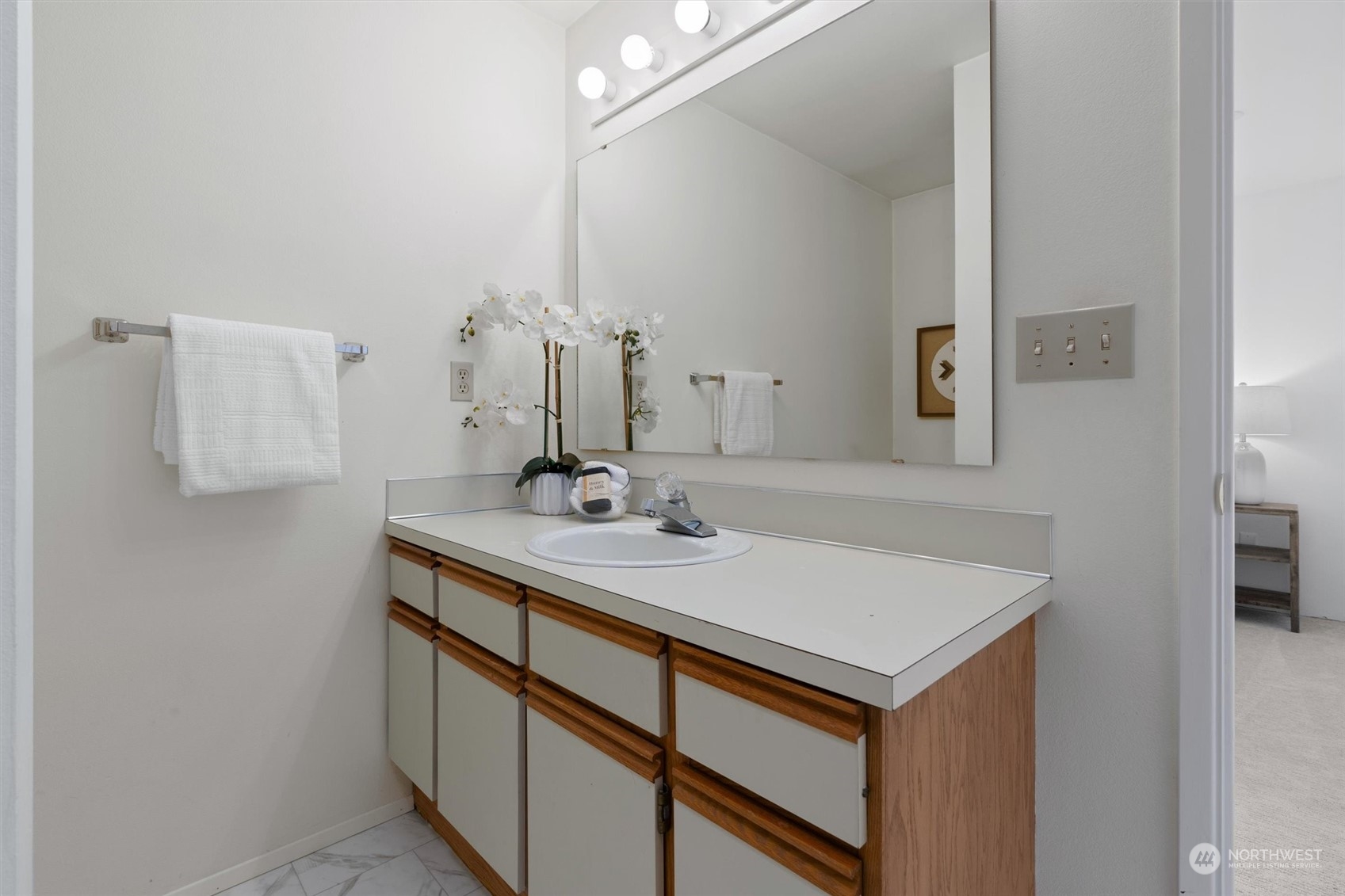 7209 Dayton Avenue North Seattle, WA 98103 - Photo 22 of 33 a bathroom with a sink and a mirror