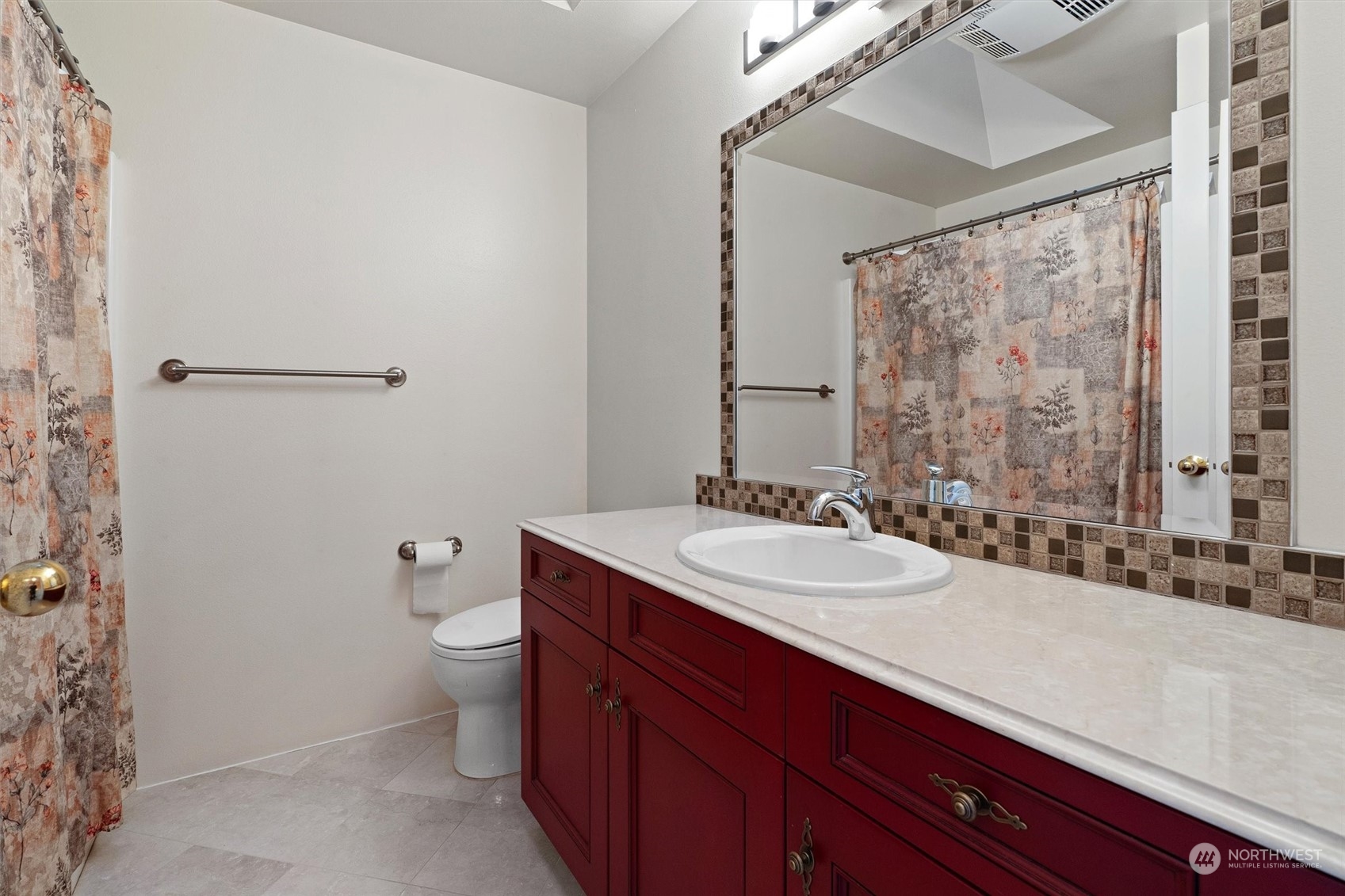 7209 Dayton Avenue North Seattle, WA 98103 - Photo 26 of 33 a bathroom with a double vanity sink toilet and a mirror