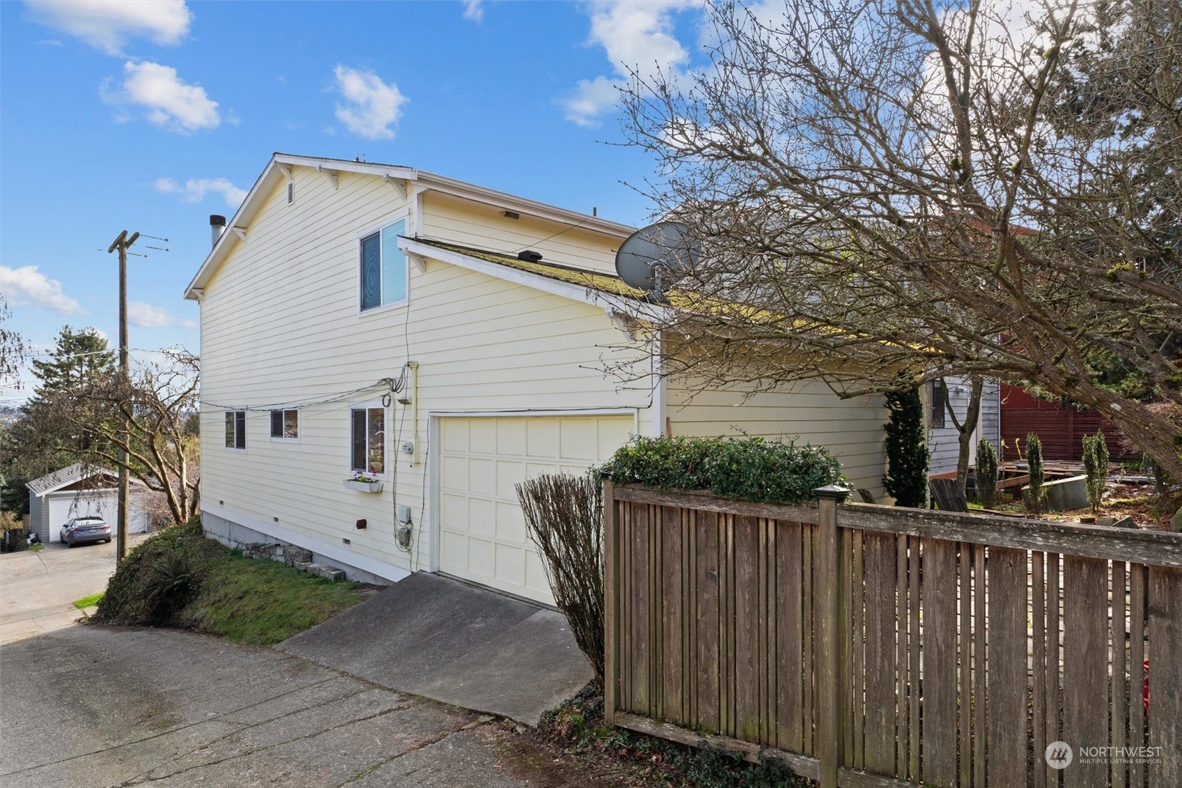 7209 Dayton Avenue North Seattle, WA 98103 - Photo 32 of 33 a front view of house with wooden fence