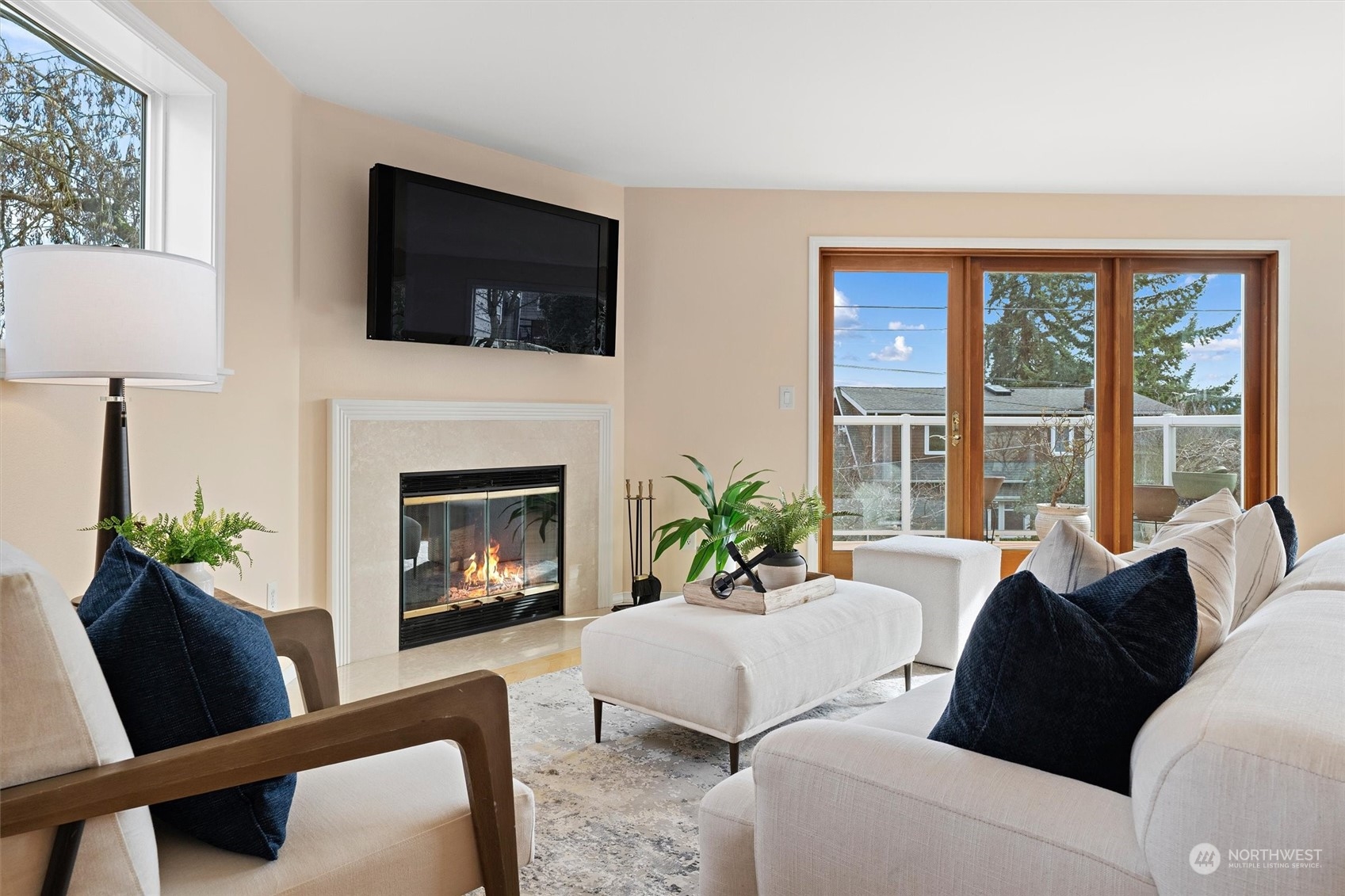 7209 Dayton Avenue North Seattle, WA 98103 - Photo 5 of 33 a living room with furniture a fireplace and a flat screen tv