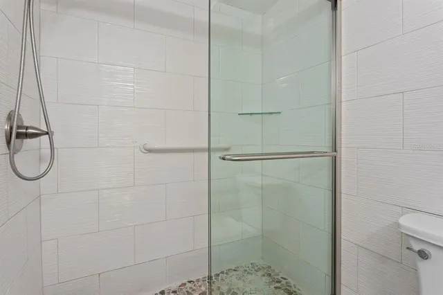 a view of a large window with chair and table in front of it