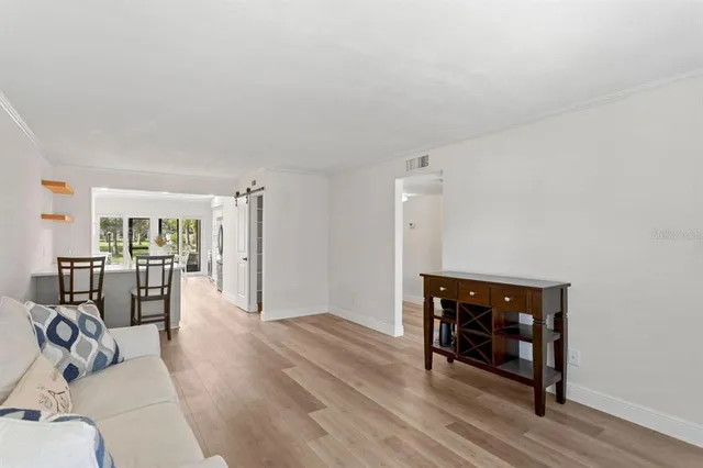 a view of a livingroom with furniture and wooden floor
