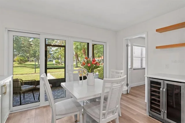 a view of a dining room with furniture window and outside view