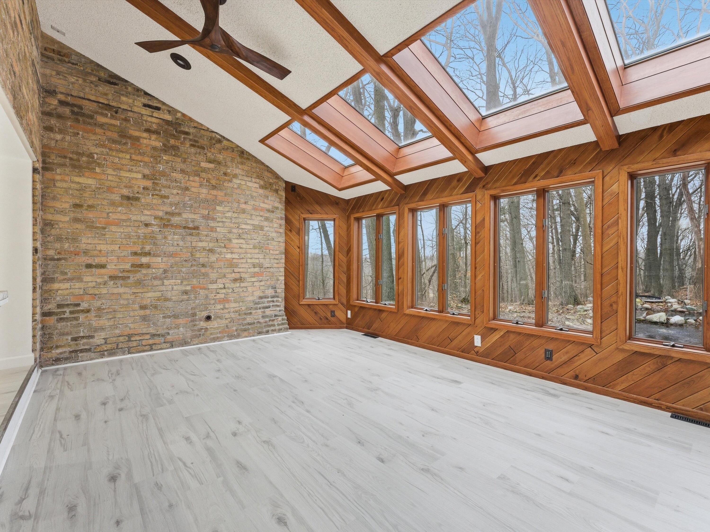 1608 North Rapids Road Manitowoc, WI 54220 - Photo 38 of 72 Skylights and wall of windows in Sun room/Dinning room