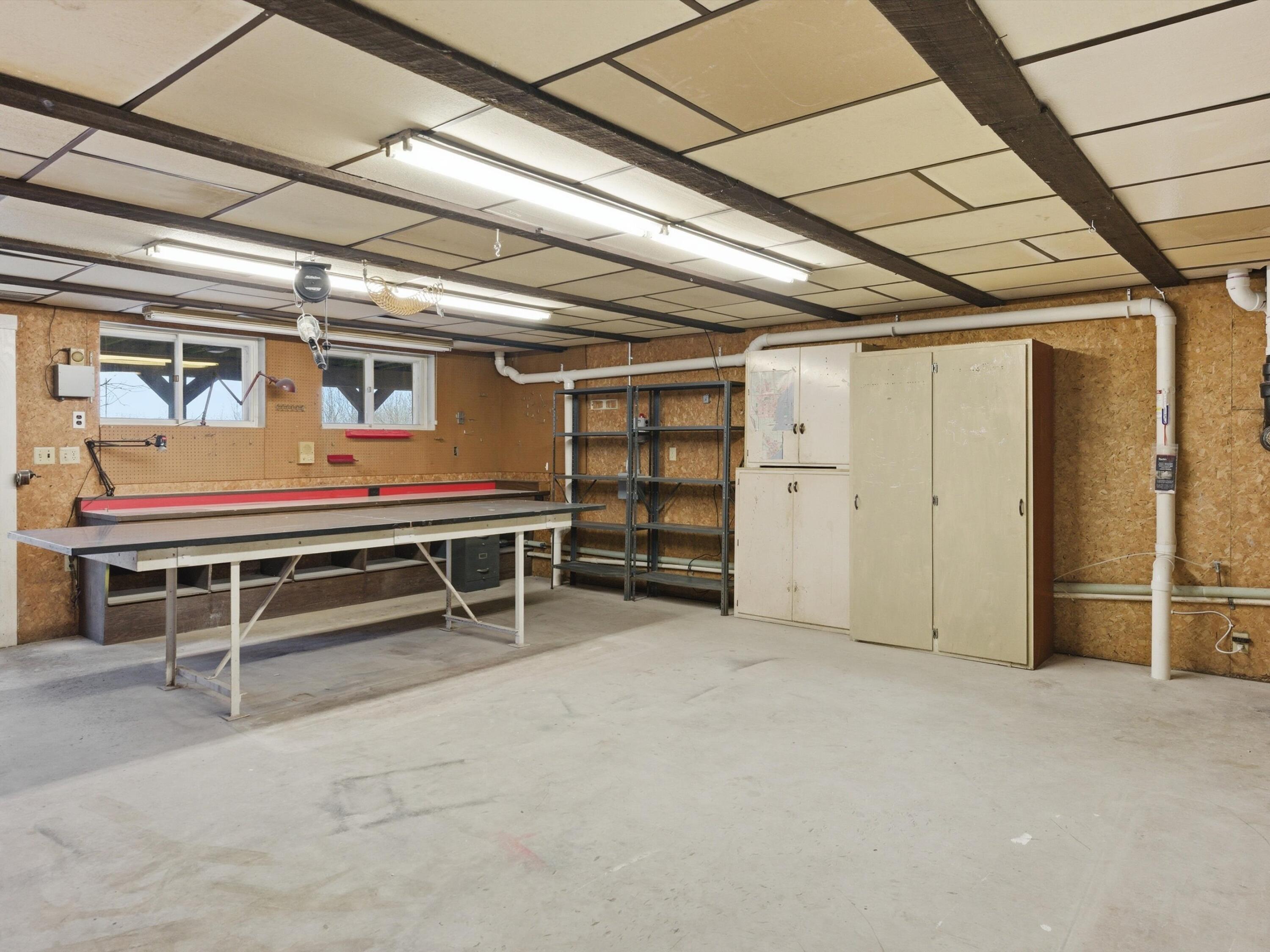 1608 North Rapids Road Manitowoc, WI 54220 - Photo 59 of 72 Lower Shop area piped in air and Patio door to patio