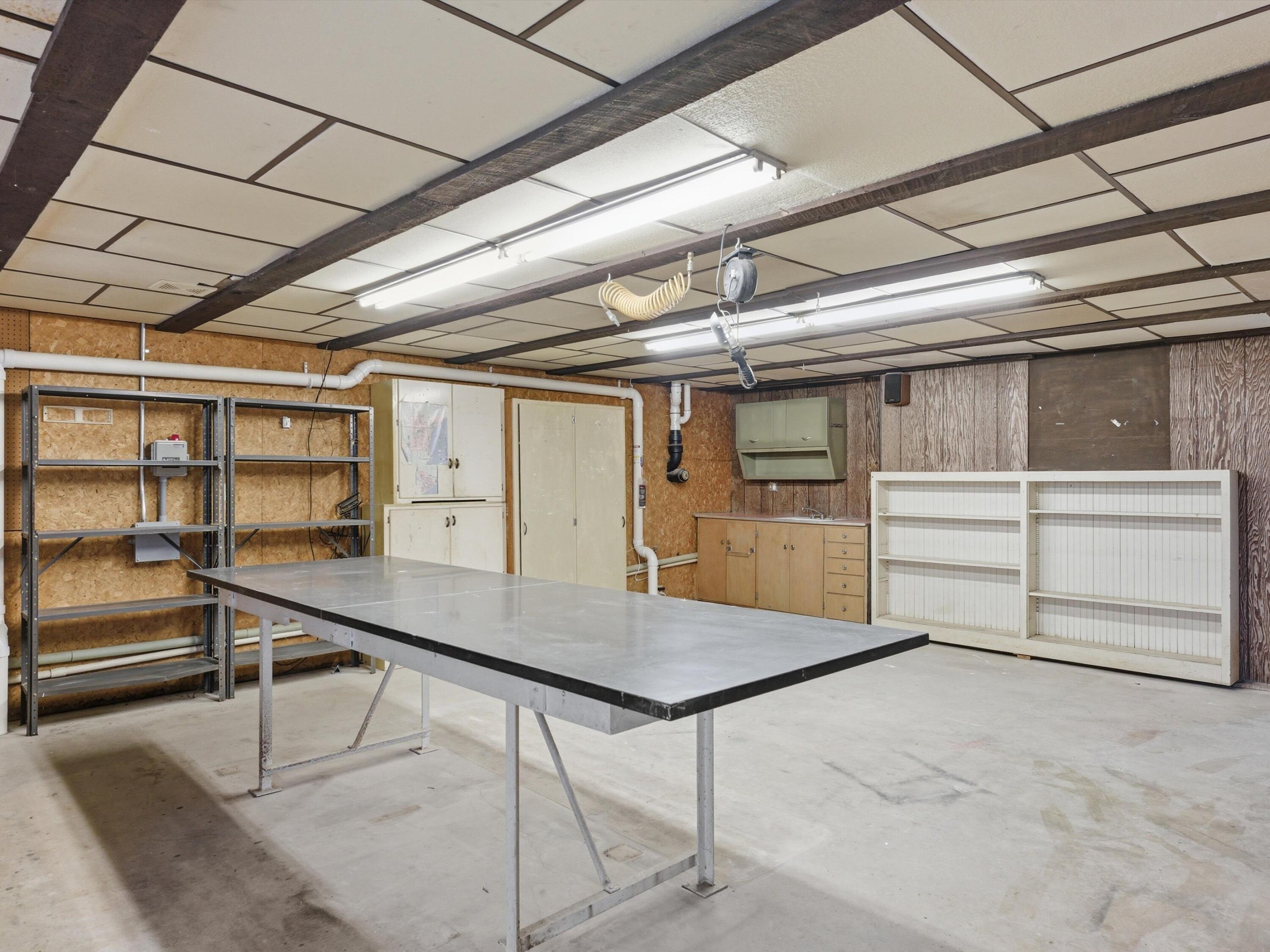 1608 North Rapids Road Manitowoc, WI 54220 - Photo 60 of 72 Lower Shop area piped in air and Patio door to patio