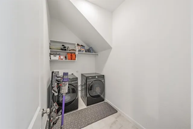 a bathroom with a double vanity sink and mirror
