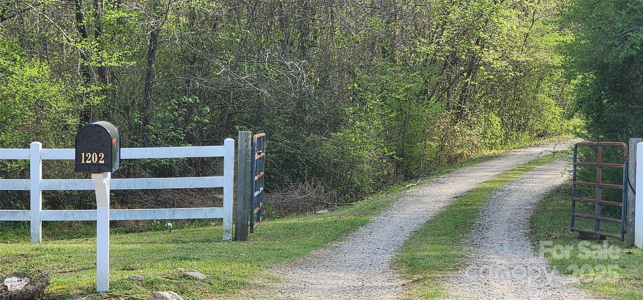2351 Reges Store Road Nashville, NC 27856 - Photo 35 of 48 a backyard of a house with wooden floor and fence
