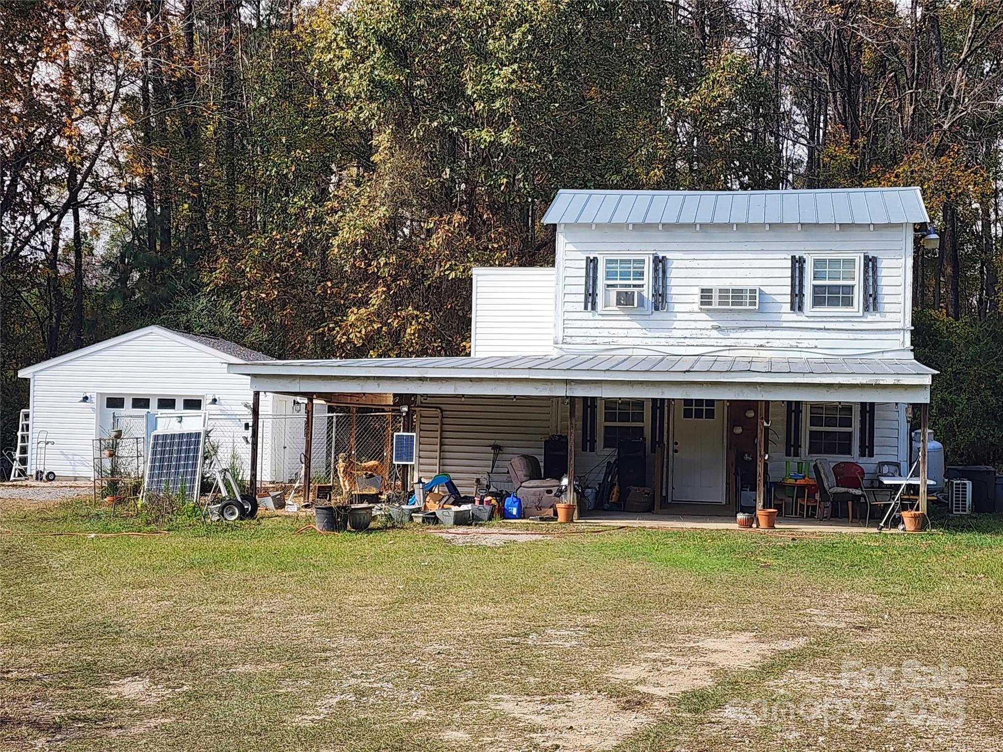 2351 Reges Store Road Nashville, NC 27856 - Photo 38 of 48 a view of a house with a yard and sitting area