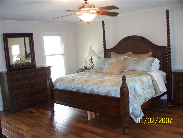 4809 Manners Road Lebanon, TN 37087 - Photo 13 of 19 a bedroom with a bed and wooden floor