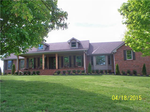 4809 Manners Road Lebanon, TN 37087 - Photo 3 of 19 a front view of a house with garden and trees