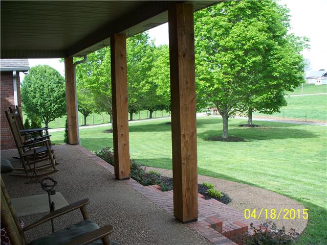 4809 Manners Road Lebanon, TN 37087 - Photo 5 of 19 a view of a patio with a table chairs and a backyard