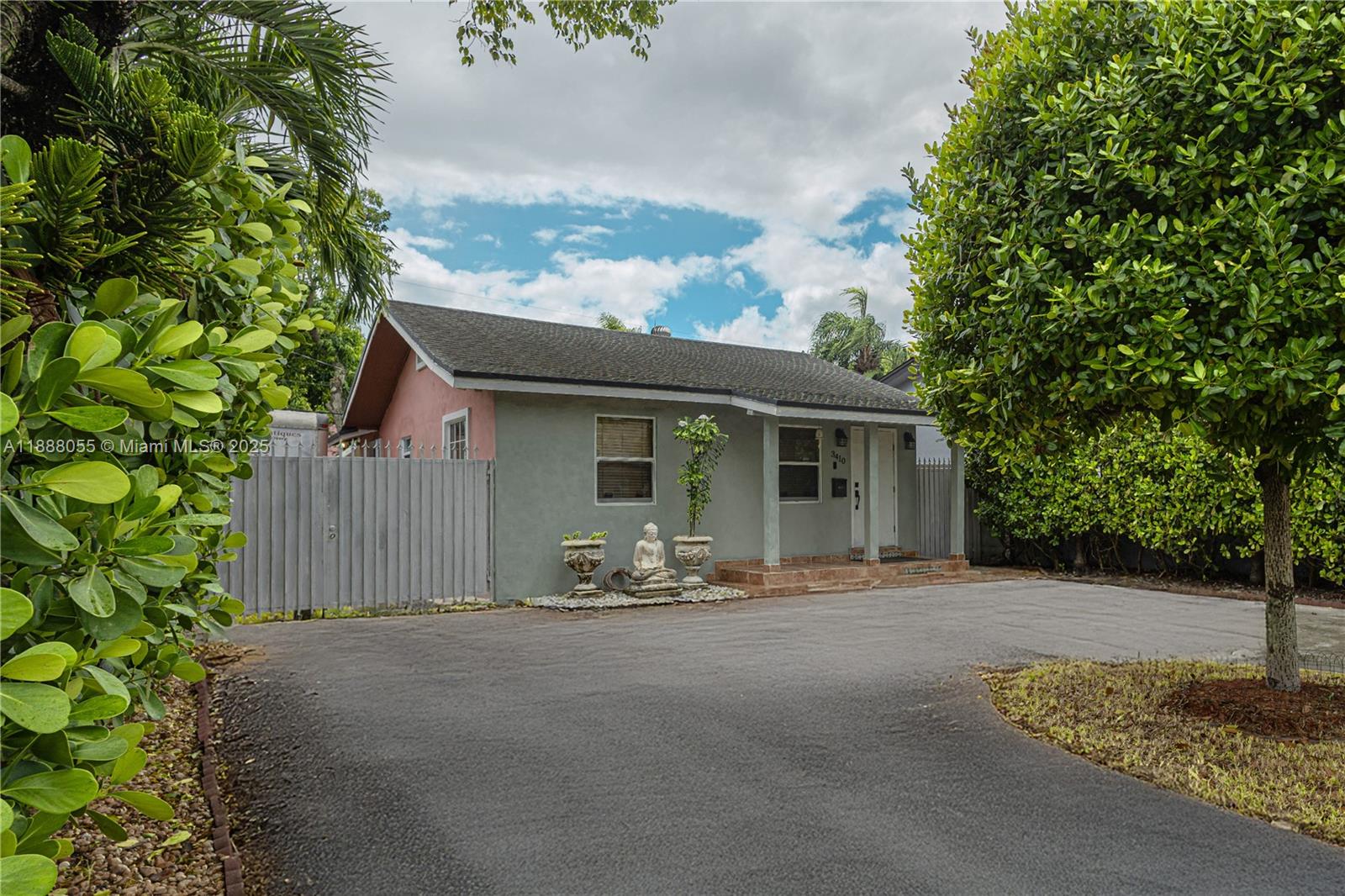a front view of a house with garden