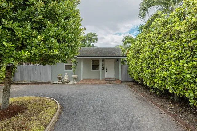 front view of a house with a garden