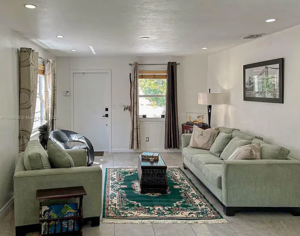 a living room with furniture and a rug