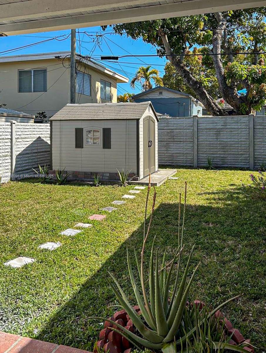 3410 Southwest 24th Street Miami, FL 33145 - Photo 7 of 8 a view of a house with a yard