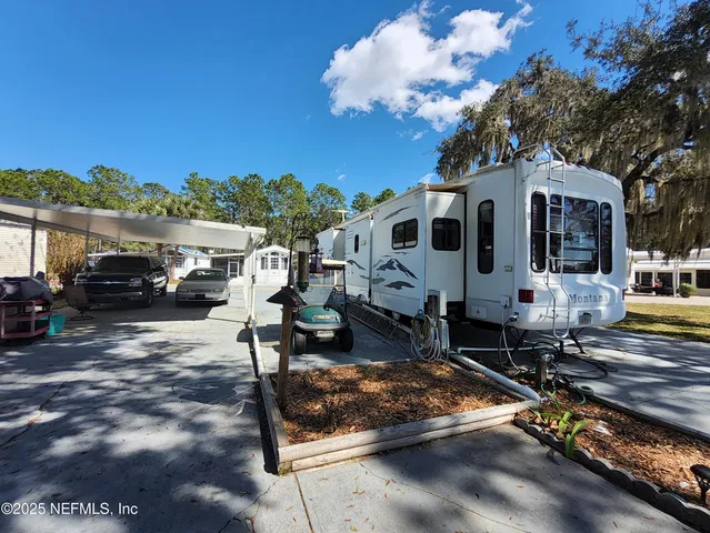 a front view of a house with sitting area
