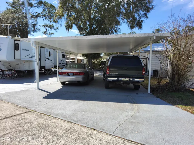 a view of a storage room with a table and chairs