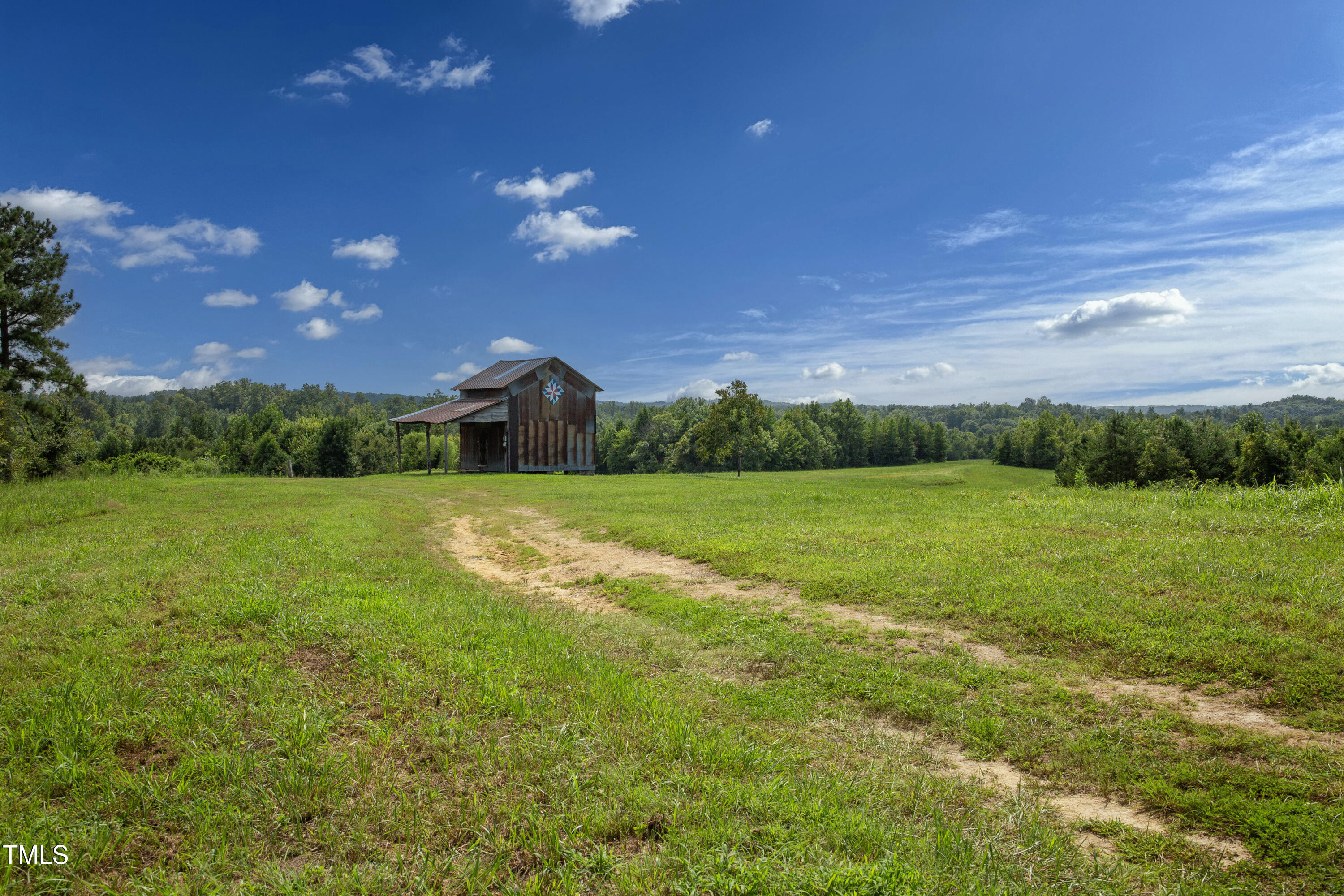 0 Weadon Road Blanch, NC 27212 - Photo 3 of 21 a view of a big yard with a house in the background