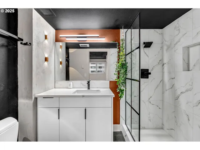 a bathroom with a sink and mirror