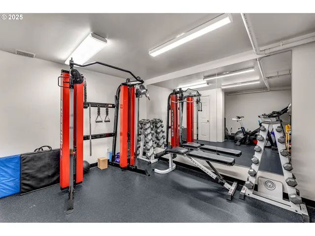 a view of a room with gym equipment