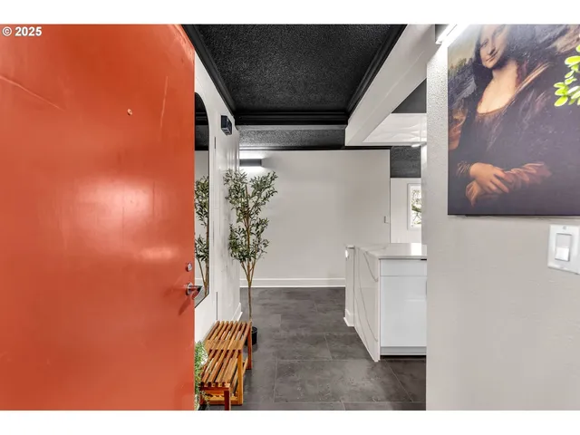 a view of entryway and kitchen