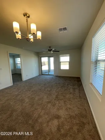 a large kitchen with kitchen island a sink stainless steel appliances and a counter top