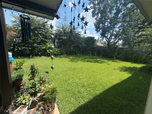 a view of a golf course with a tree