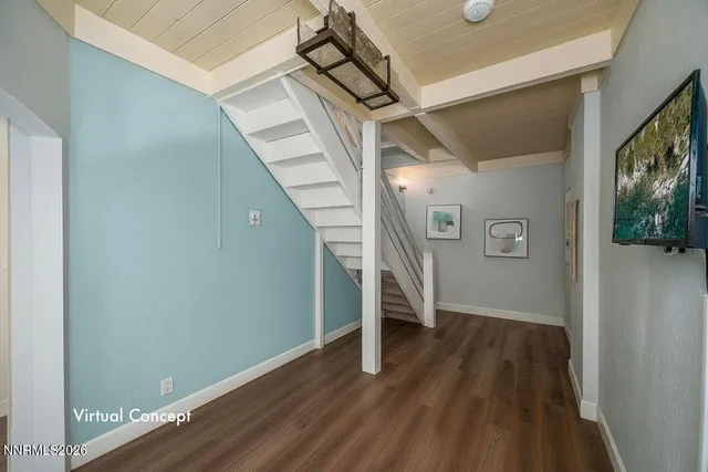 a view of entryway and hall with wooden floor