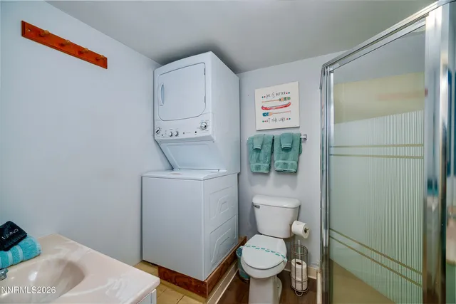 a bathroom with a toilet sink and shower