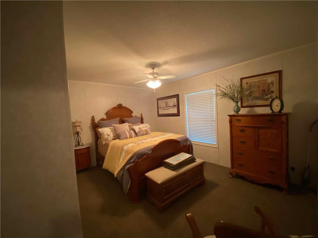 383 Gillis Road Roxboro, NC 27574 - Photo 13 of 19 a bedroom with a bed and dresser