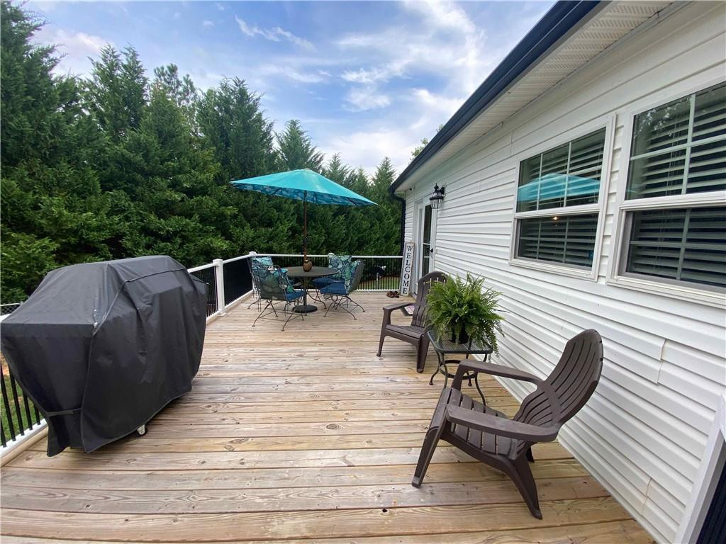383 Gillis Road Roxboro, NC 27574 - Photo 17 of 19 a view of a backyard with sitting area