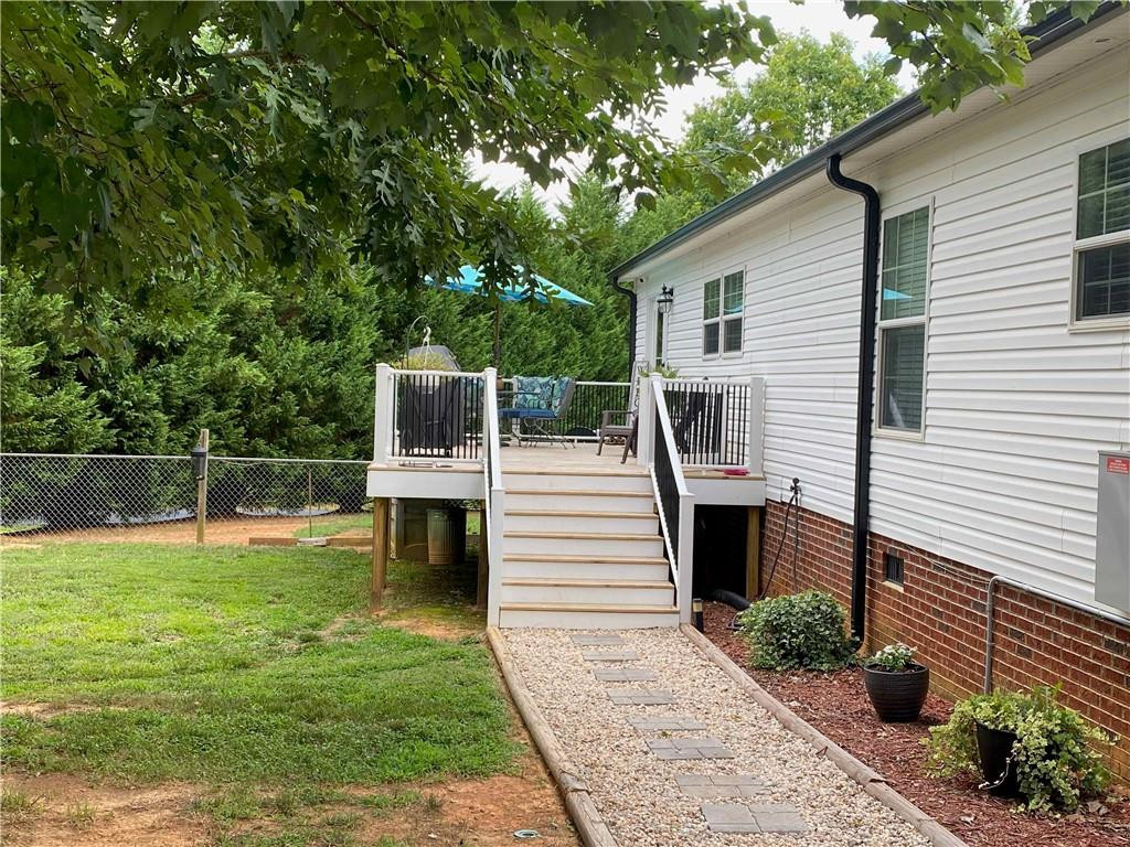 383 Gillis Road Roxboro, NC 27574 - Photo 18 of 19 a view of a house with a backyard