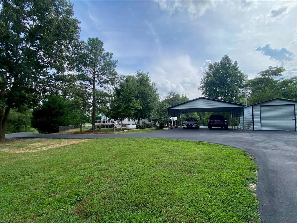 383 Gillis Road Roxboro, NC 27574 - Photo 19 of 19 a view of a swimming pool and lounge chairs in back yard