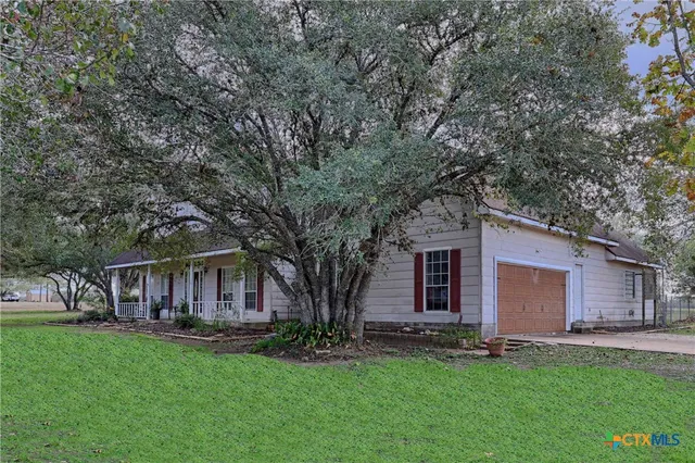 a view of a back yard with green space