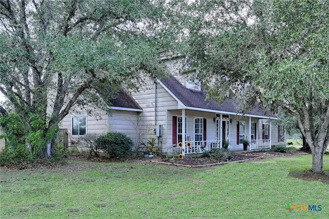 an aerial view of residential house with outdoor space