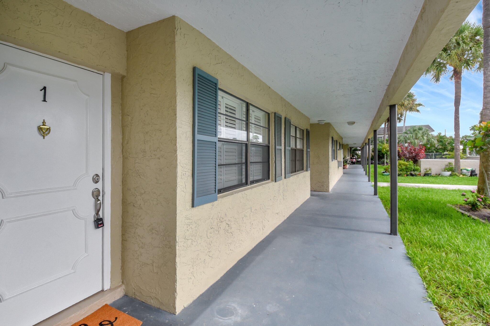 1401 Northwest 15th Avenue, Unit 1 Boca Raton, FL 33486 - Photo 2 of 34 front