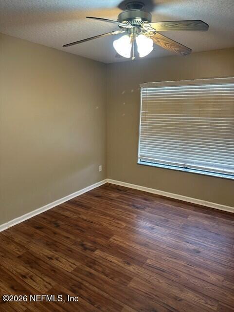 45035 Hartford Court Callahan, FL 32011 - Photo 16 of 30 a view of empty room with wooden floor and window