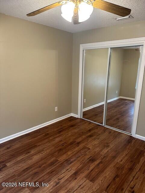 45035 Hartford Court Callahan, FL 32011 - Photo 20 of 30 a view of an empty room with wooden floor and a window