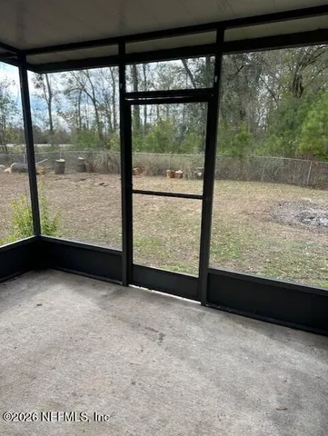 a view of an empty room with a large window