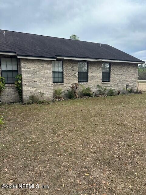 45035 Hartford Court Callahan, FL 32011 - Photo 27 of 30 a front view of a house with a garden
