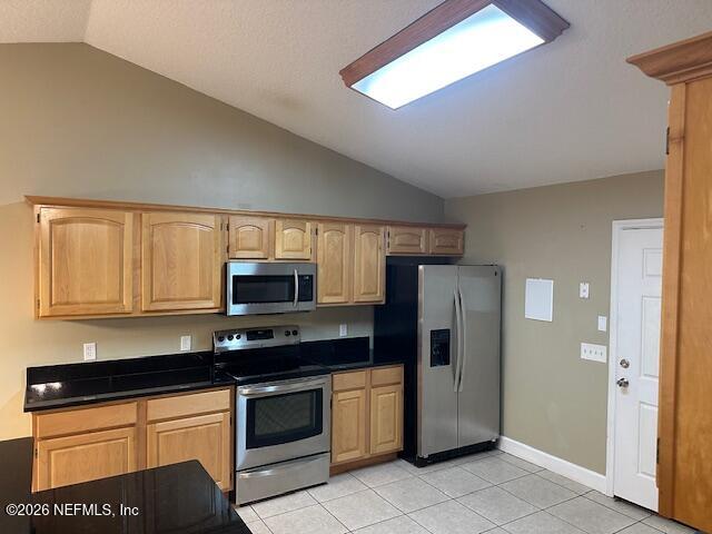 45035 Hartford Court Callahan, FL 32011 - Photo 9 of 30 a kitchen with granite countertop a refrigerator and a stove top oven