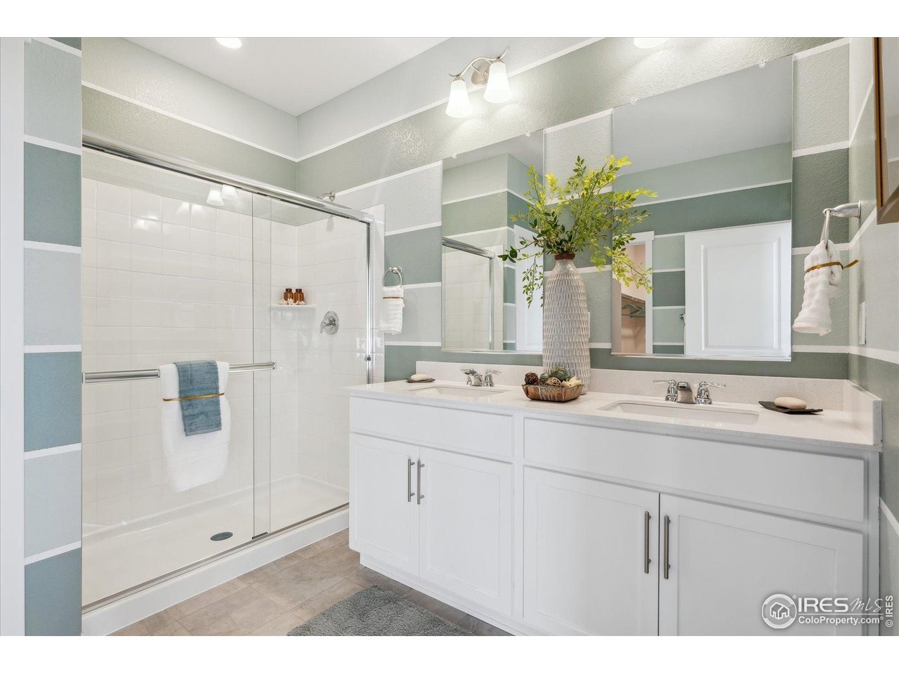 2303 Base Street Fort Lupton, CO 80621 - Photo 24 of 26 a bathroom with a sink double vanity and a mirror