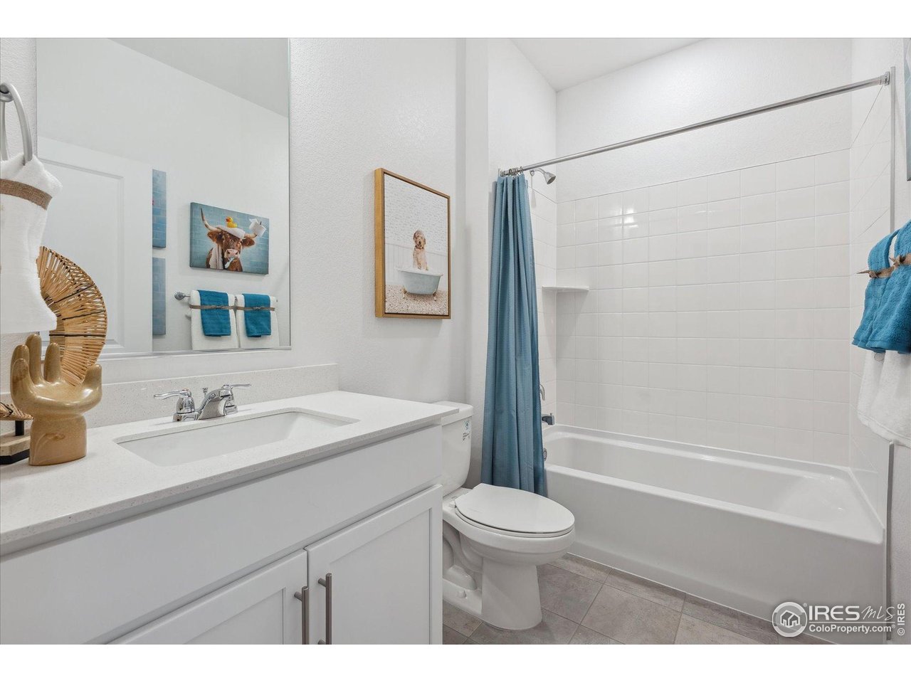 2303 Base Street Fort Lupton, CO 80621 - Photo 4 of 26 a bathroom with a granite countertop sink toilet and shower