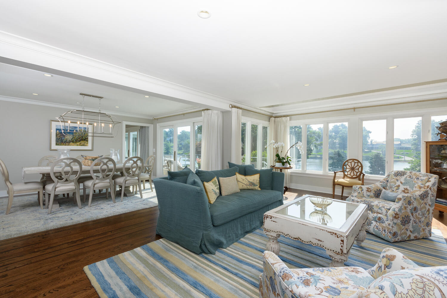 79 Rings End Road Darien, CT 06820 - Photo 12 of 42 a living room with furniture large window and a table