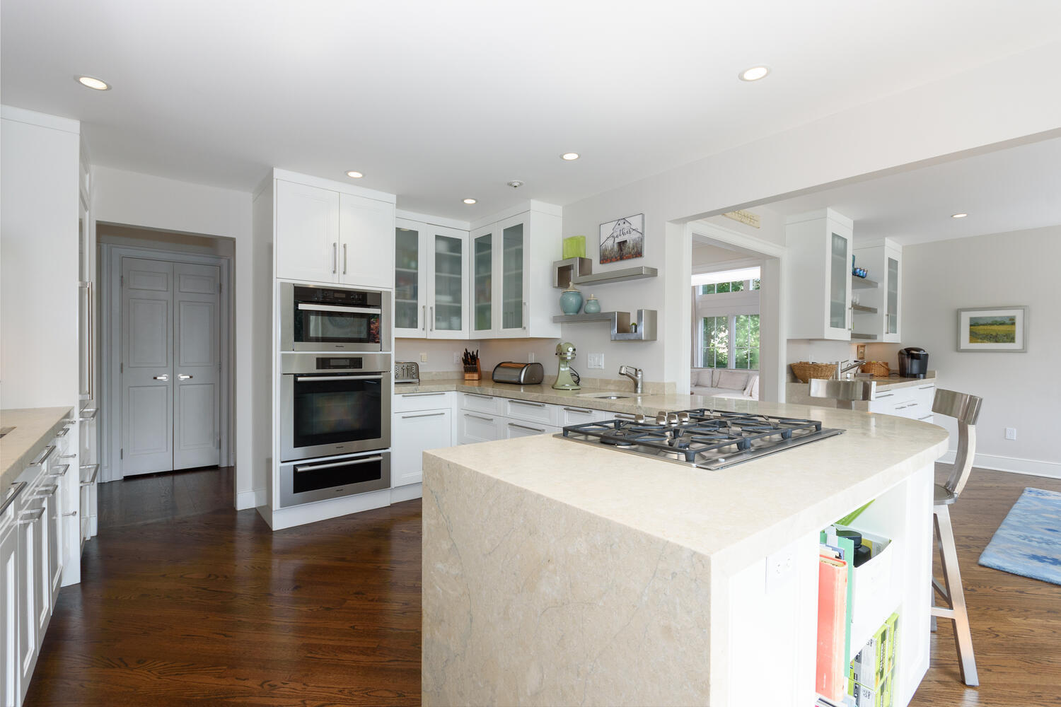 79 Rings End Road Darien, CT 06820 - Photo 16 of 42 a kitchen with stainless steel appliances a stove a sink a microwave and a refrigerator