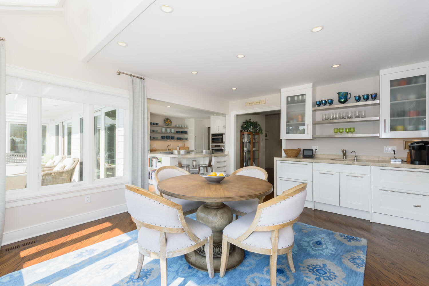 79 Rings End Road Darien, CT 06820 - Photo 18 of 42 a dining room with furniture and wooden floor